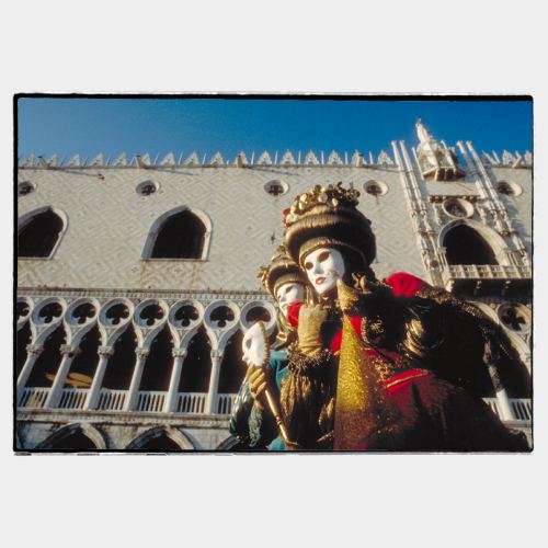 Venice:  two masks in front of the Palazzo Ducale